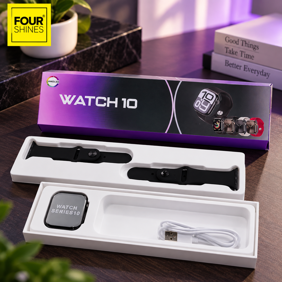 A boxed smartwatch shown open with a black smartwatch and a white charging cable inside white trays, with the retail box behind it on a dark wooden table. The box reads WATCH 10, and a yellow FOUR SHINES logo appears in the top-left corner.