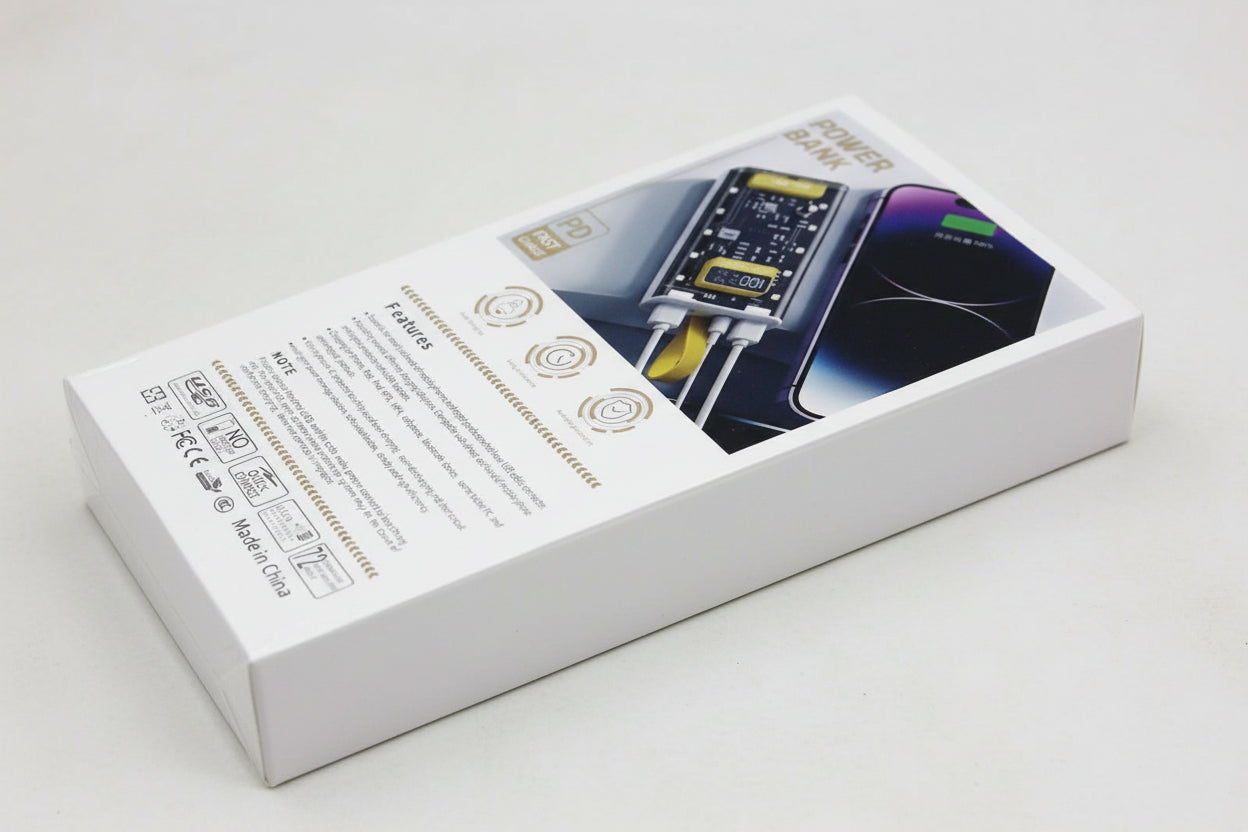 Power bank packaging with charging cable on a textured surface