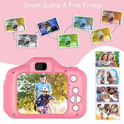 A child holding a blue digital camera with a 2.0 inch screen, displaying a smiling face on the screen.