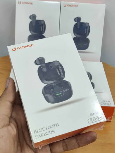 Gionee Bluetooth earbuds packaging held by a hand with a blurred background
