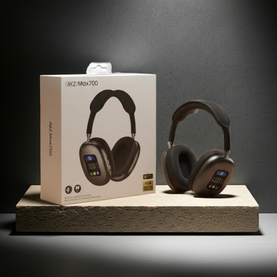 Pair of over-ear headphones with a branded box on a dark background