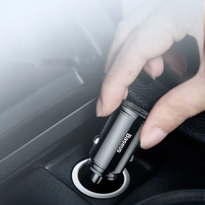 Hand using a car air freshener holder with 'BESSES' branding.