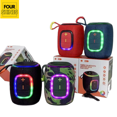 Colorful fabric Bluetooth speakers with LED lights on a white background, featuring the brand 'Four Shines'.