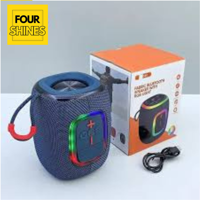 Blue portable speaker with colorful lights next to its packaging on a light gray background