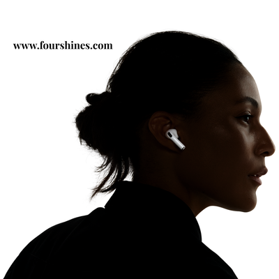 Silhouette of a person wearing wireless earbuds with 'www.fourshines.com' text.