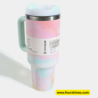 Stanley tumbler with a colorful marbled design on a white background