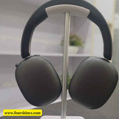 Black headphones on a stand with a blurred background