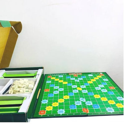 Packaging for the Scrabble Brain Vocabulary Game Original, featuring the game's name and a visual representation of the game board and tiles.