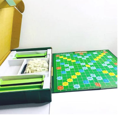 Packaging for the Scrabble Brain Vocabulary Game Original, featuring the game's name and a visual representation of the game board and tiles.