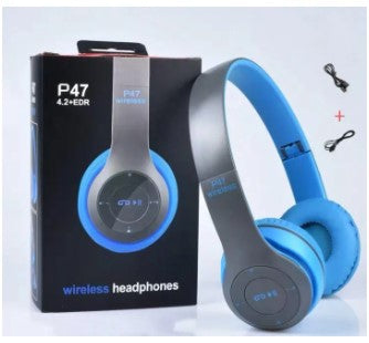 A pair of blue P47 wireless Bluetooth headphones displayed next to its packaging box and a USB charging cable.