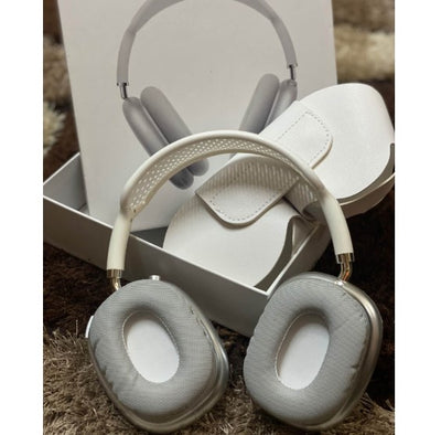 A pair of gray Apple AirPods Max colon wireless Bluetooth headphones with their smart case and packaging box.