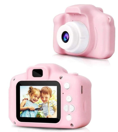 A child holding a blue digital camera with a 2.0 inch screen, displaying a smiling face on the screen.