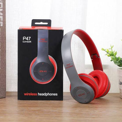 A pair of red and gray P47 multifunctional noise-cancelling, mic, plus FM foldable wireless Bluetooth stereo headphones displayed next to its packaging box.