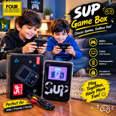 Two boys sitting on a couch in a living room, each holding a smartphone. In front of them are two retail boxes and one portable retro game console with a small LCD screen, plus promotional text overlays for the SUP Game Box.