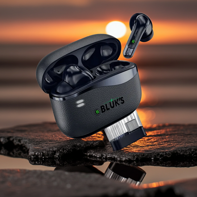 Black wireless earbuds with charging case on a reflective surface with sunset background