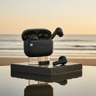 Black wireless earbuds with charging case on a reflective surface with a blurred natural background