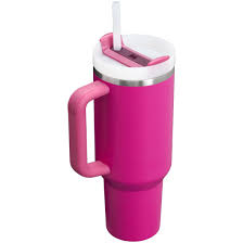 Pink tumbler with a handle and straw on a white background