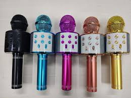 Set of six colorful microphones on a white background