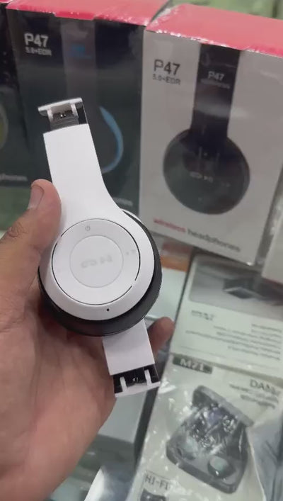 P47 wireless Bluetooth headphones displayed next to its packaging box and a USB charging cable.