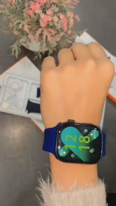Three GW9 MAX smart watches with silicone bands in black, blue, and gray colors, displayed alongside their packaging.